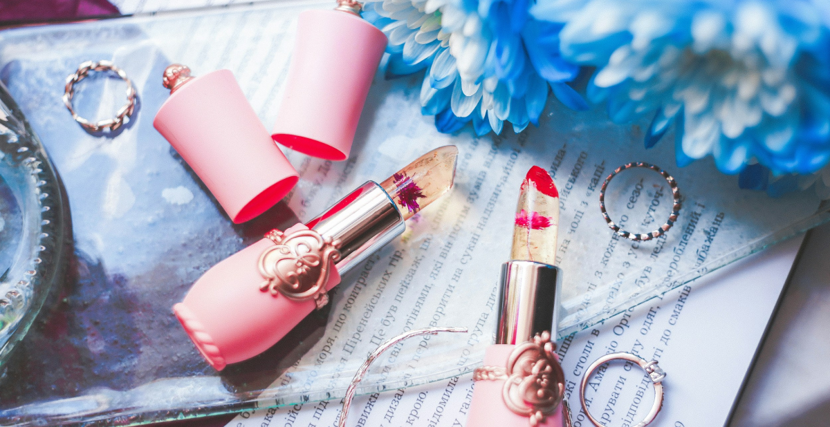 Lipsticks with a background of blue flowers