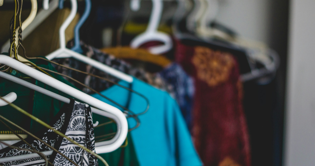 Clothes on hangers in closet