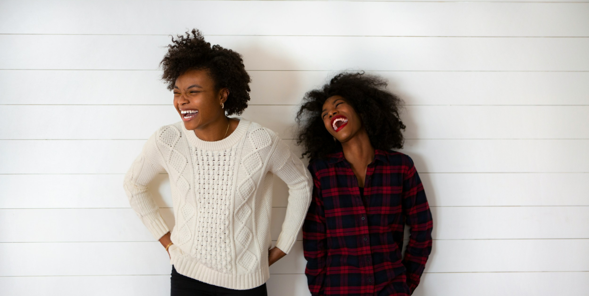 Two women laughing together